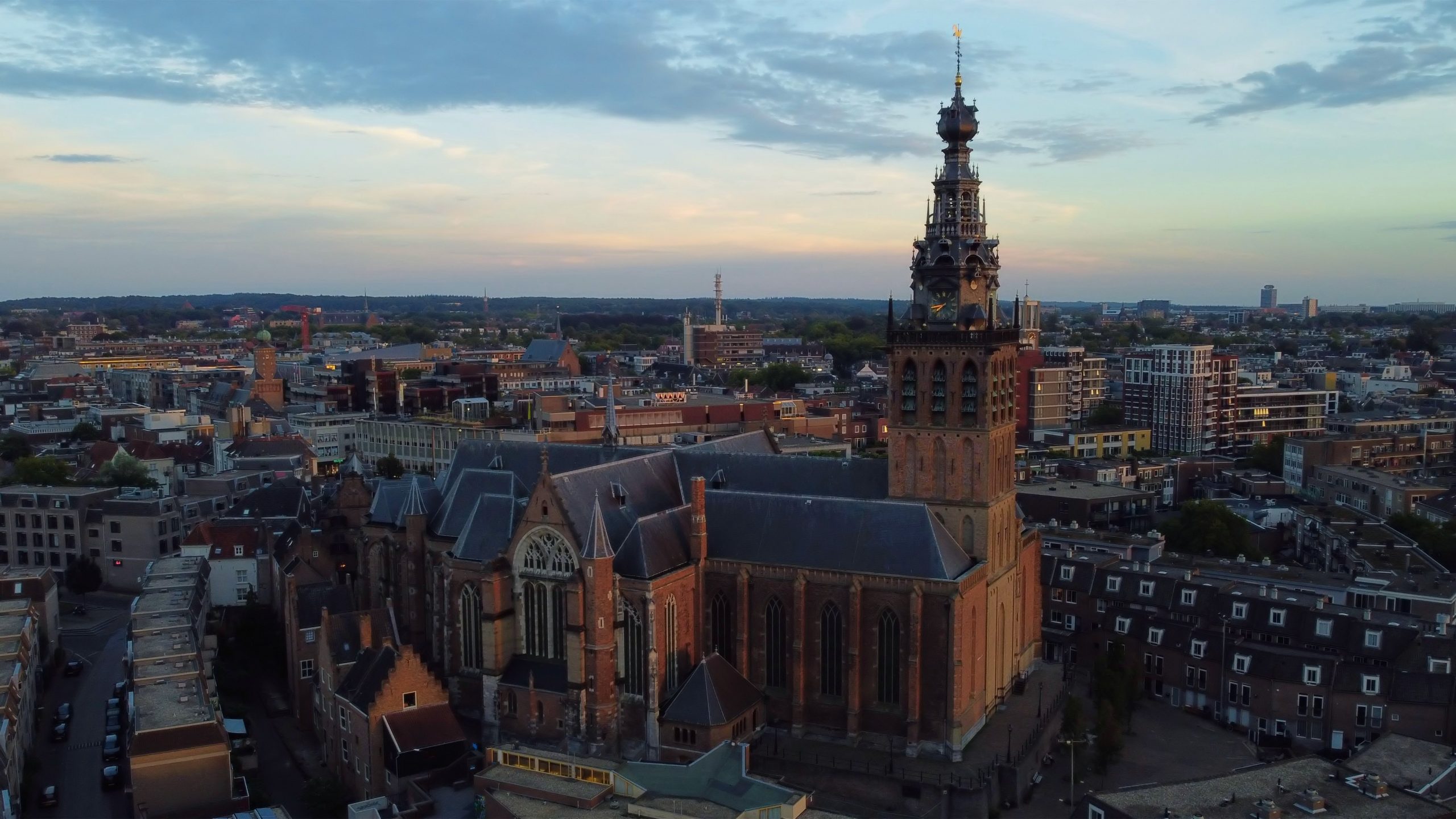 An aerial view of Nijmegen with a prominent church tower.